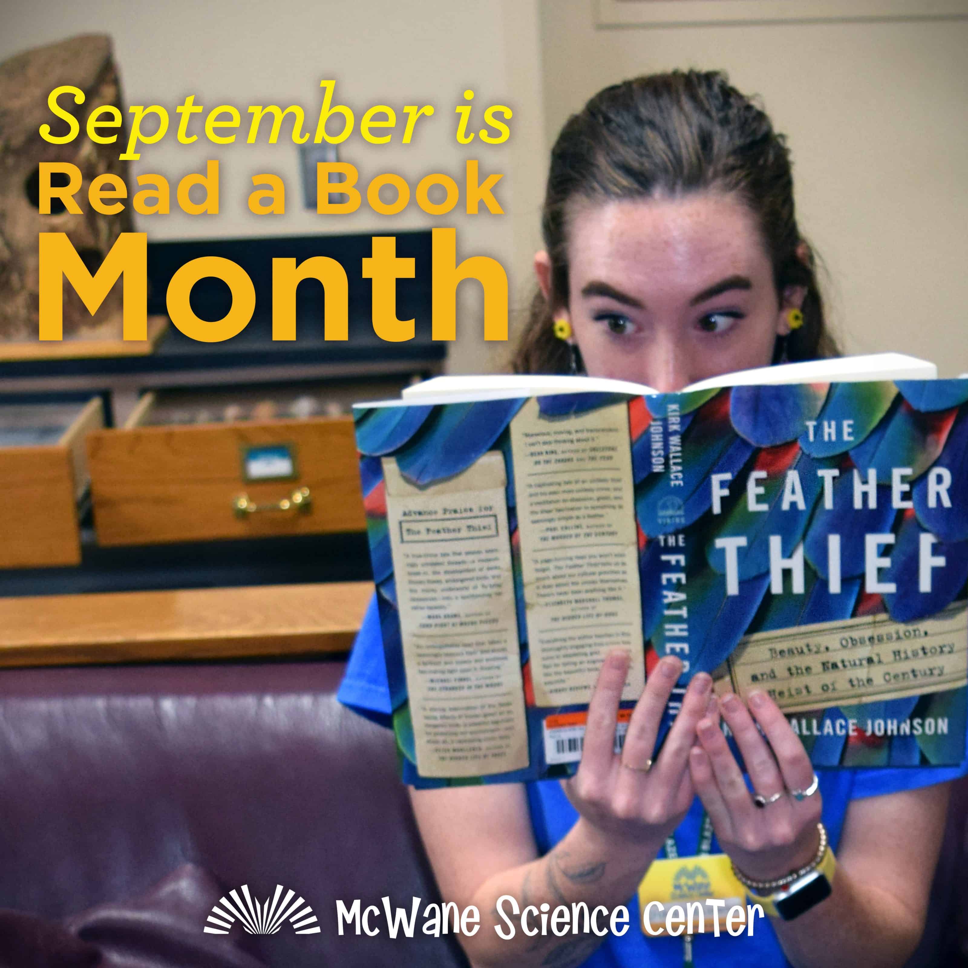 A person reading The Feather Thief at McWane Science Center, celebrating September Read a Book Month for kids and families
