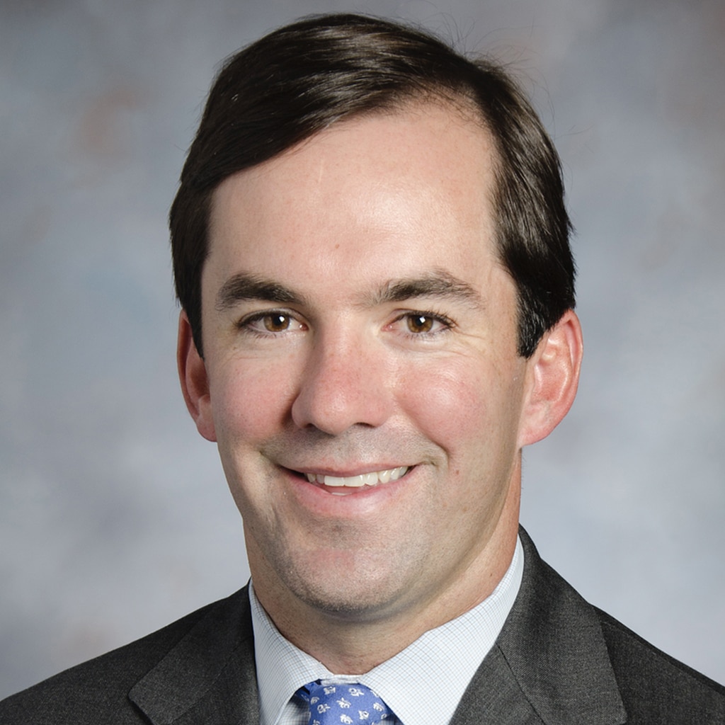 Smiling man in suit and tie, Children's Science Center leadership portrait